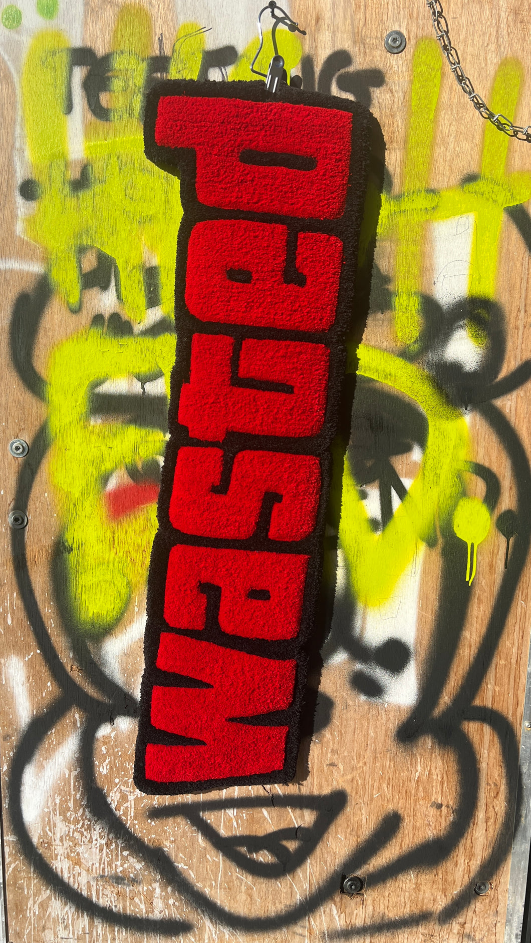 “WASTED” TUFTED RUG.