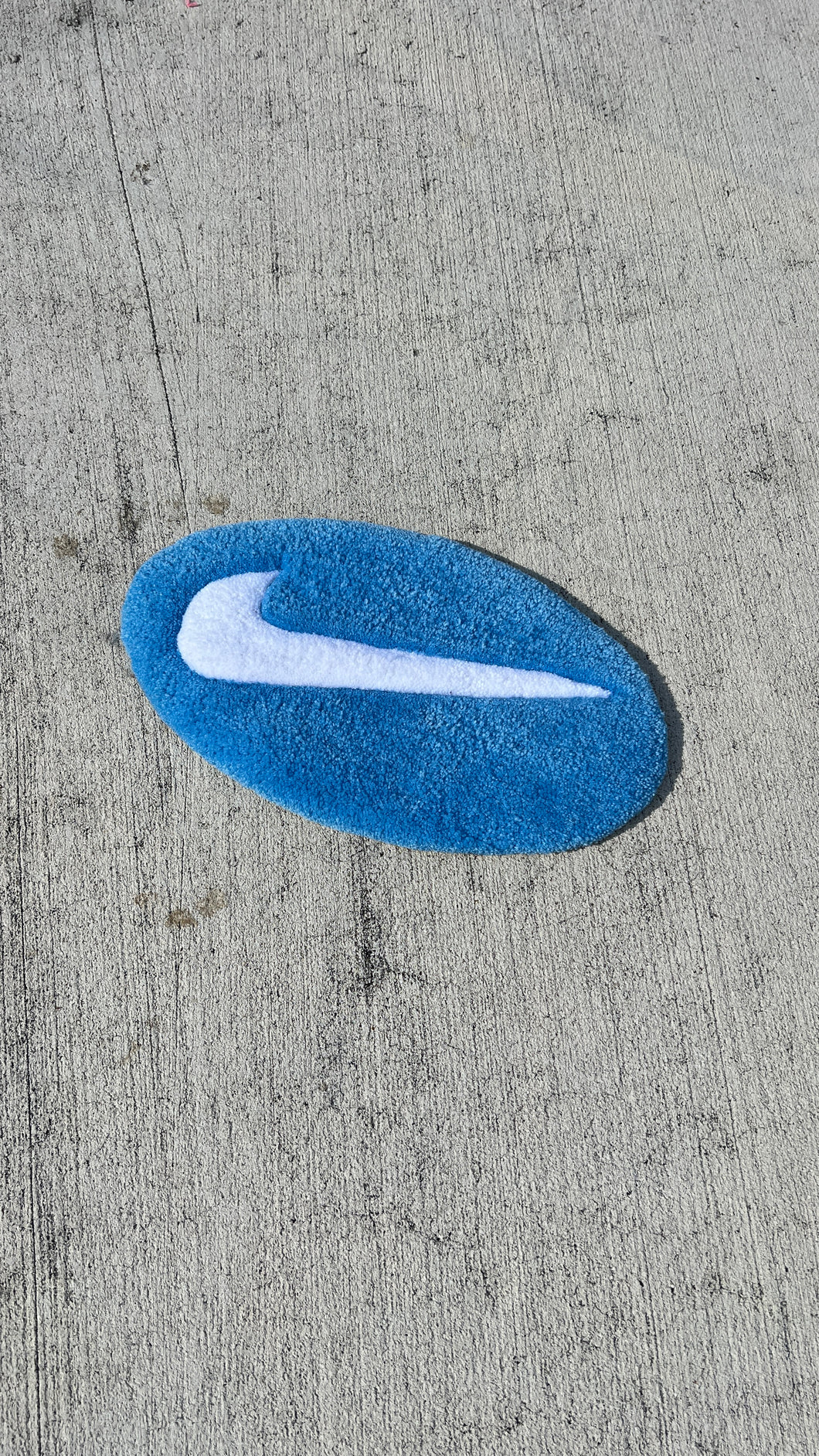 NIKE SWOOSH TUFTED RUG.